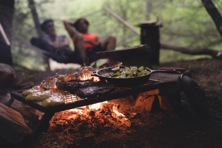 Budget Travel Tips Cooking in Forest scaled