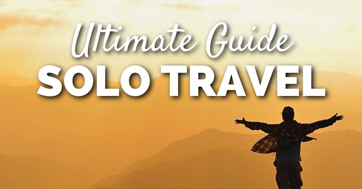 Solo Travel guide on top of mountain